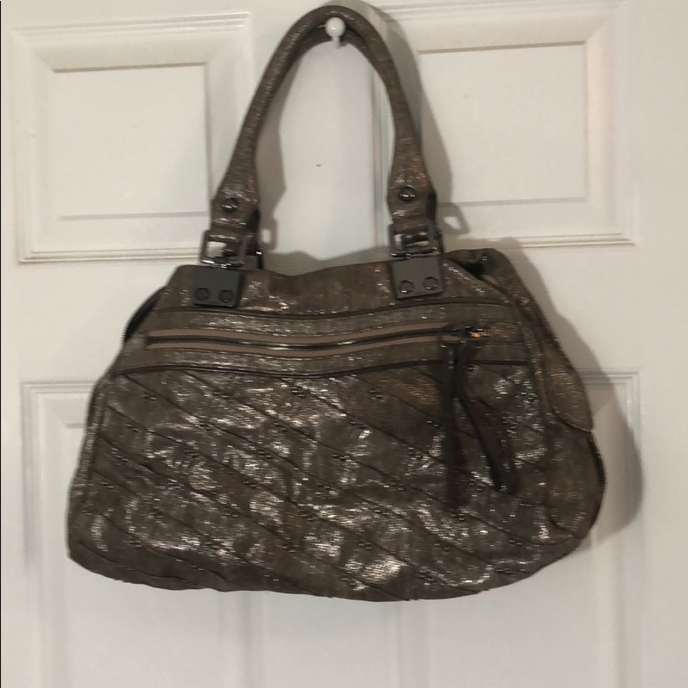 Excellent condition metallic with leather trim.